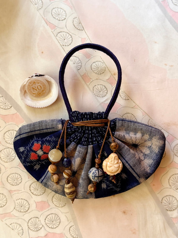 Vessel With Amulet Drawstring and Decision Stone