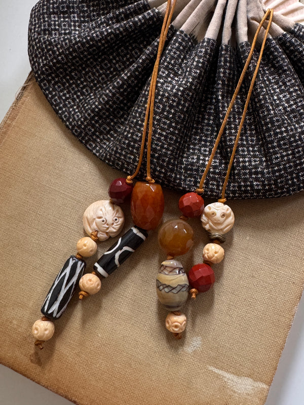 Vessel With Amulet Drawstring